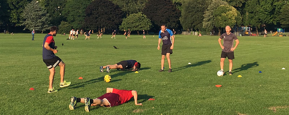 A Ripped Club London session in Wandsworth Park, with cones and balls laid out on the grass